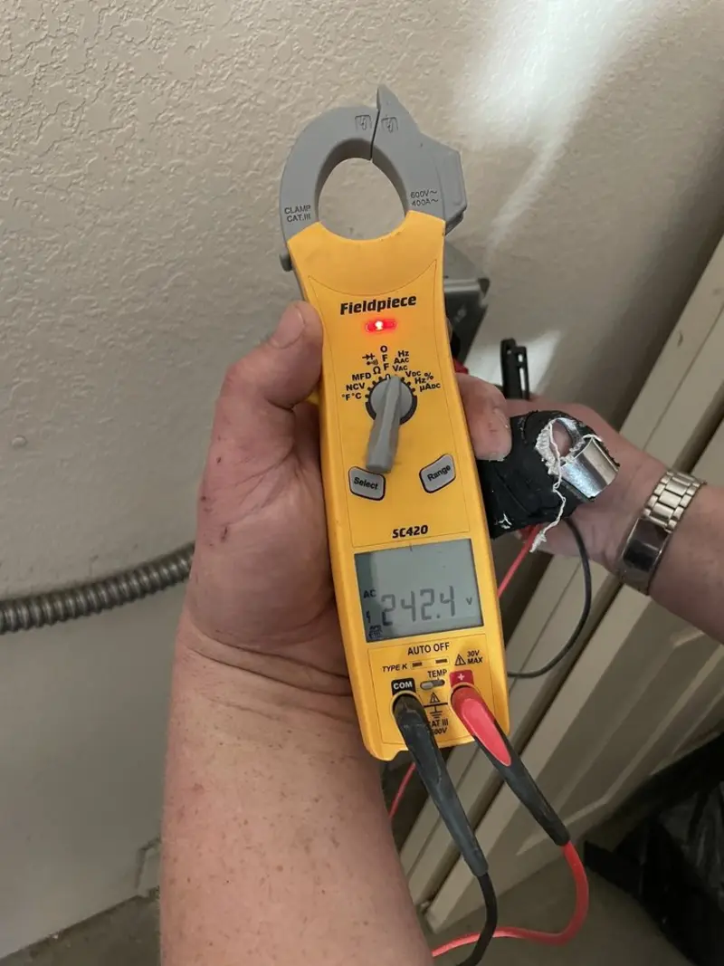 Voltage testing with clamp meter during Electrical Installation Services in West Miami